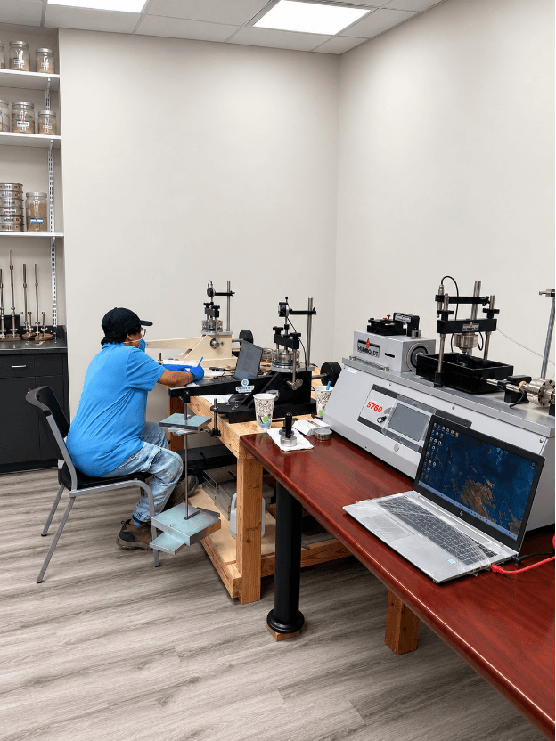 Consolidation test being performed on the soil sample